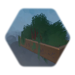 Metal planter with soil and shrubs