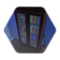 Cupboard with books and elephant ornament.